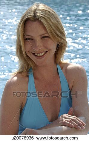 Woman is applying sunlotion View Large Photo Image Stock Photograph - Woman is applying sunlotion. Fotosearch