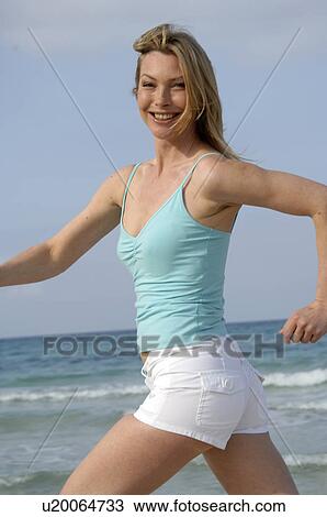 Woman jogging at the sea View Large Photo Image Stock Image - Woman jogging at the sea. Fotosearch