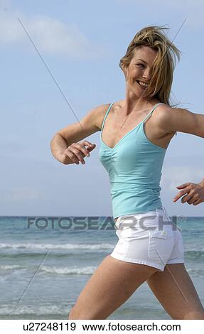 Woman jogging at the sea View Large Photo Image Stock Photo - Woman jogging at the sea. Fotosearch