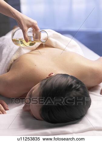 Woman, massage with massage oil View Large Photo Image Stock Photography - Woman, massage with massage oil. Fotosearch