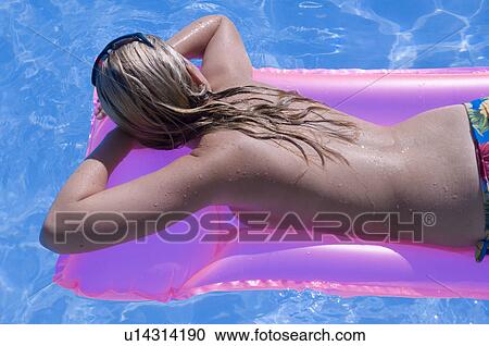Woman on a airmattress View Large Photo Image Stock Image - Woman on a airmattress. Fotosearch