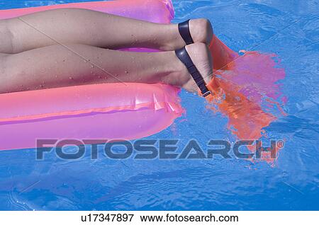 Woman on a airmattress View Large Photo Image Stock Photo - Woman on a airmattress. Fotosearch