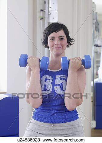 woman on dumbbell training View Large Photo Image Stock Photo - woman on dumbbell training. Fotosearch