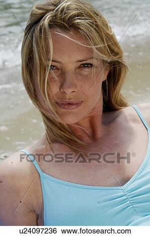 Stock Photograph - Woman on the beach. Fotosearch