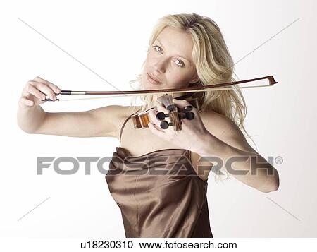 Stock Image - Woman playing violin. Fotosearch