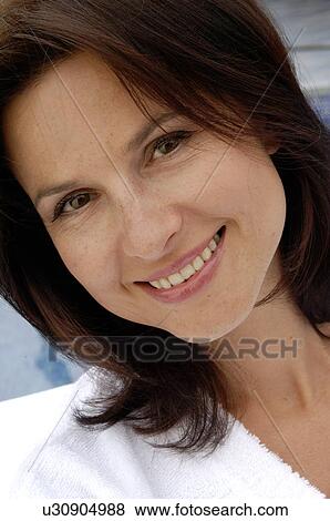 Stock Photo - Woman tilts her head. Fotosearch