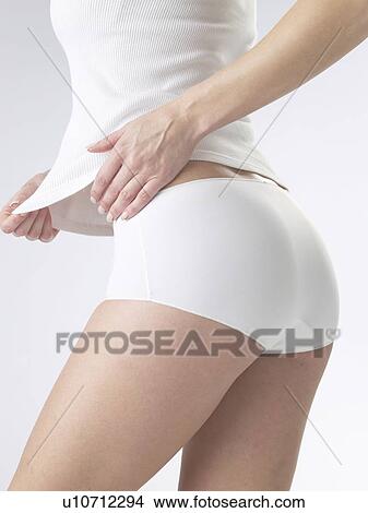 Woman wearing white underwear, backside View Large Photo Image Picture - Woman wearing white underwear, backside. Fotosearch