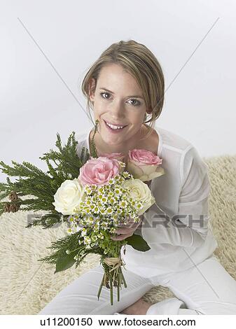 Stock Image - Woman with a bouquet. Fotosearch