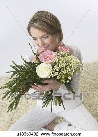 Stock Image - Woman with a bouquet. Fotosearch