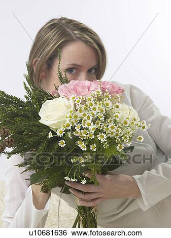 Stock Photograph - Woman with a bouquet. Fotosearch