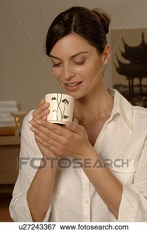Woman with a cup of tea View Large Photo Image Stock Photo - Woman with a cup of tea. Fotosearch
