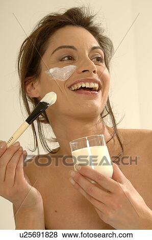 Woman with a facial mask View Large Photo Image Stock Photo - Woman with a facial mask. Fotosearch