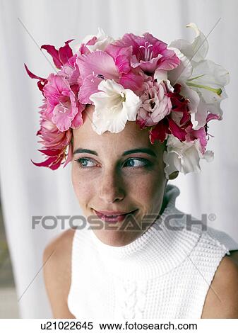 Stock Photography - Woman with a flower cap. Fotosearch
