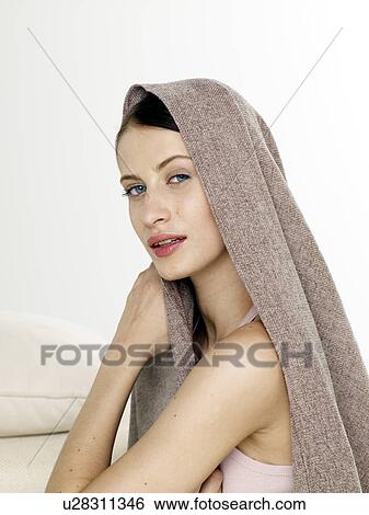 Stock Photograph - Woman with a sheet. Fotosearch