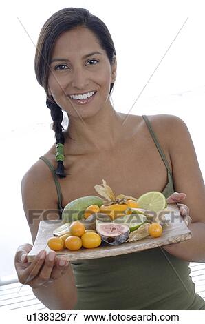 Woman with bowl of fruits View Large Photo Image Stock Photo - Woman with bowl of fruits. Fotosearch