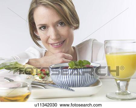Woman with brakfast table View Large Photo Image Stock Image - Woman with brakfast table. Fotosearch