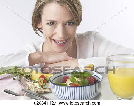 Woman with brakfast table View Large Photo Image Stock Photo - Woman with brakfast table. Fotosearch