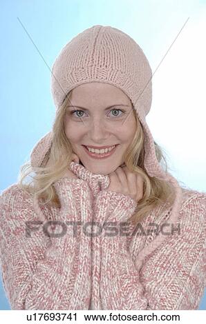 Stock Image - Woman with cotton cap and pulover. Fotosearch