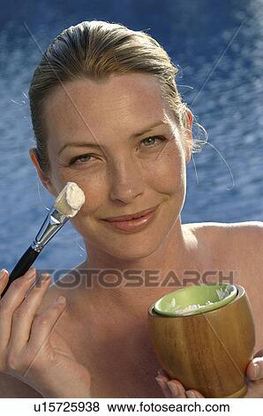 Woman with facial mask and brush View Large Photo Image Stock Photo - Woman with facial mask and brush. Fotosearch