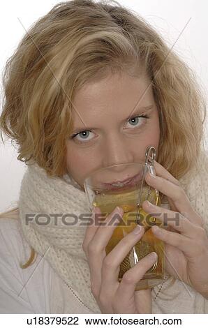 Woman with hot tea View Large Photo Image Stock Image - Woman with hot tea. Fotosearch