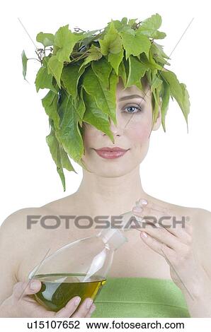 Woman with leaves on her head drinking red wine View Large Photo Image Stock Image - Woman with leaves on her head drinking red wine. Fotosearch