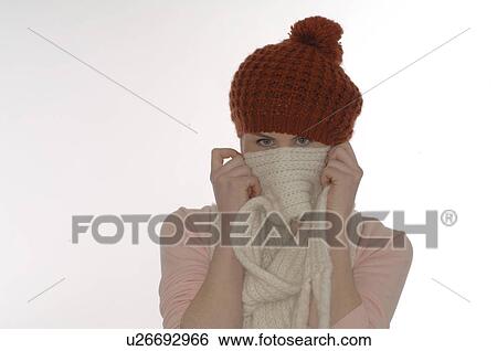 Stock Photograph - Woman with scarf and cap. Fotosearch