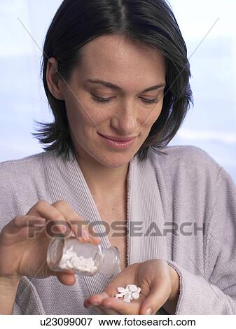 Woman with Schuessler salts View Large Photo Image Stock Photo - Woman with Schuessler salts. Fotosearch