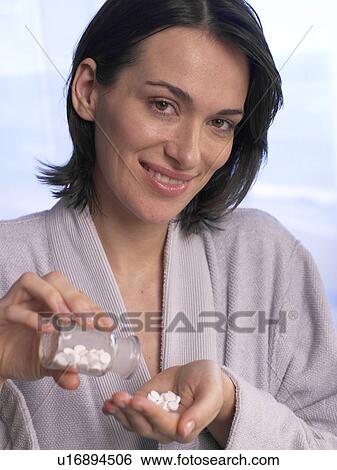 Woman with Schuessler salts View Large Photo Image Stock Photograph - Woman with Schuessler salts. Fotosearch