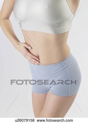 Stock Photo - Woman with sportswear, waist. Fotosearch