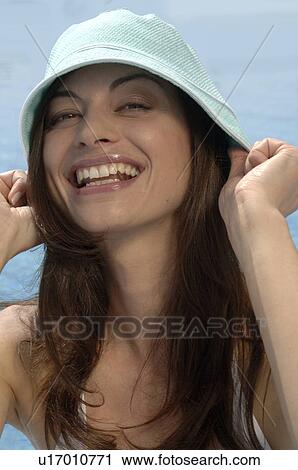 Woman with sun hat at the swimming pool View Large Photo Image Stock Image - Woman with sun hat at the swimming pool. Fotosearch