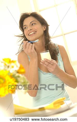 Woman with yoghurt in a glass View Large Photo Image Stock Image - Woman with yoghurt in a glass. Fotosearch