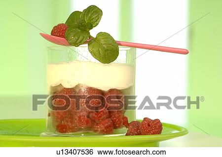 Stock Photograph - Yogurt and raspberries in a glass. Fotosearch