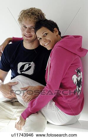 Stock Photograph - Young couple hugging. Fotosearch
