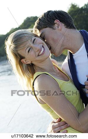 Stock Image - Young couple on the beach. Fotosearch