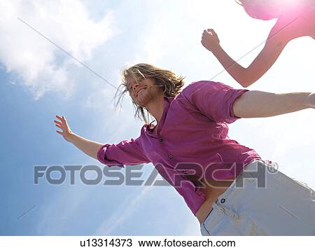 Young man in motion View Large Photo Image Stock Image - Young man in motion. Fotosearch