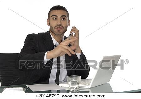 Stock Image - Young man in the office. Fotosearch