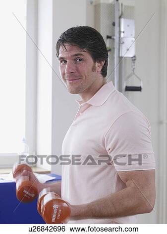 young man trianing with dump bell View Large Photo Image Stock Photograph - young man trianing with dump bell. Fotosearch