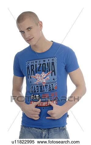 Young man wearing blue tee-shirt View Large Photo Image Stock Photography - Young man wearing blue tee-shirt. Fotosearch