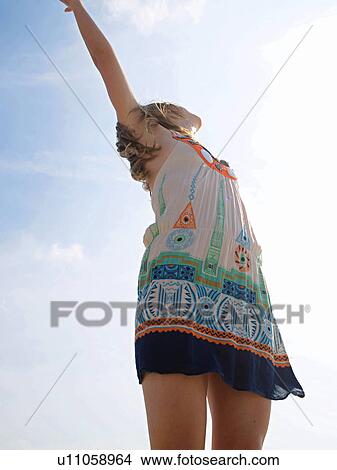 Picture - Young woman in motion. Fotosearch