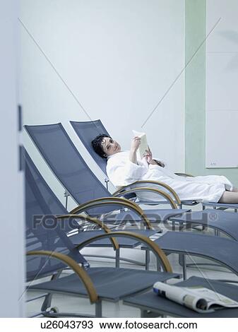 young woman in relaxation chair View Large Photo Image Stock Image - young woman in relaxation chair. Fotosearch