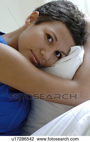 Young woman relaxing View Large Photo Image Stock Image - Young woman relaxing. Fotosearch