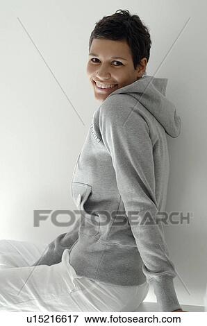 Young woman with grey sweater View Large Photo Image Stock Photo - Young woman with grey sweater. Fotosearch