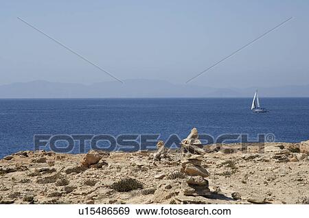 Stock Photo - Coast and a sailing ship. Fotosearch