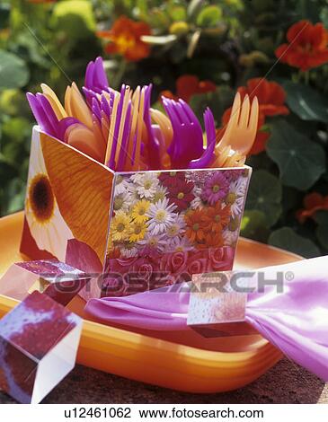 Stock Image - Cutlery box and napkin rings covered with wrapping paper. Fotosearch