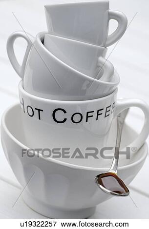 Stock Photo - Different coffee cups piled up. Fotosearch