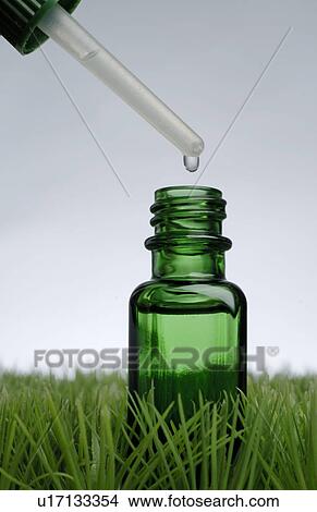 Dropping glass, symbol image for running out of oil View Large Photo Image Picture - Dropping glass, symbol image for running out of oil. Fotosearch