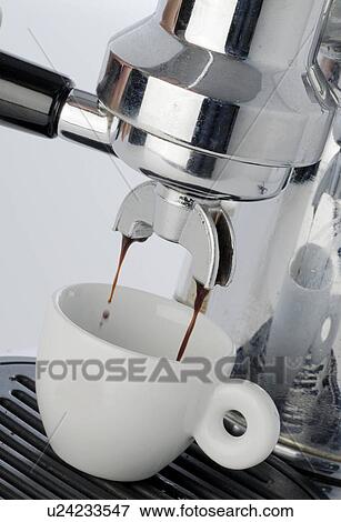 Stock Photo - Espresso flowing into a cup. Fotosearch