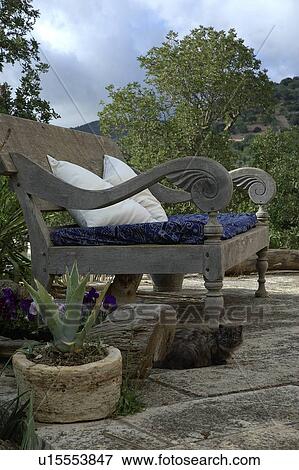 Stock Photo - Garden bench outdoors. Fotosearch