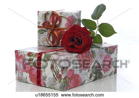 Stock Photography - Gift boxes and a rose. Fotosearch