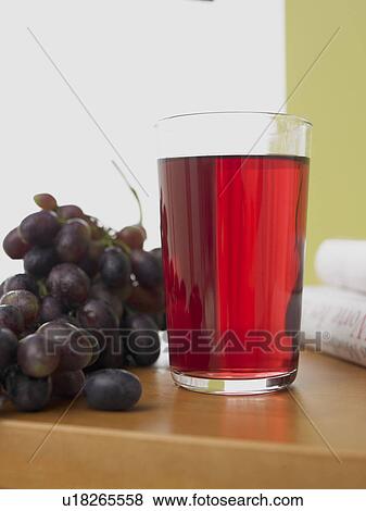 Stock Photo - Glass of red grape juice. Fotosearch
